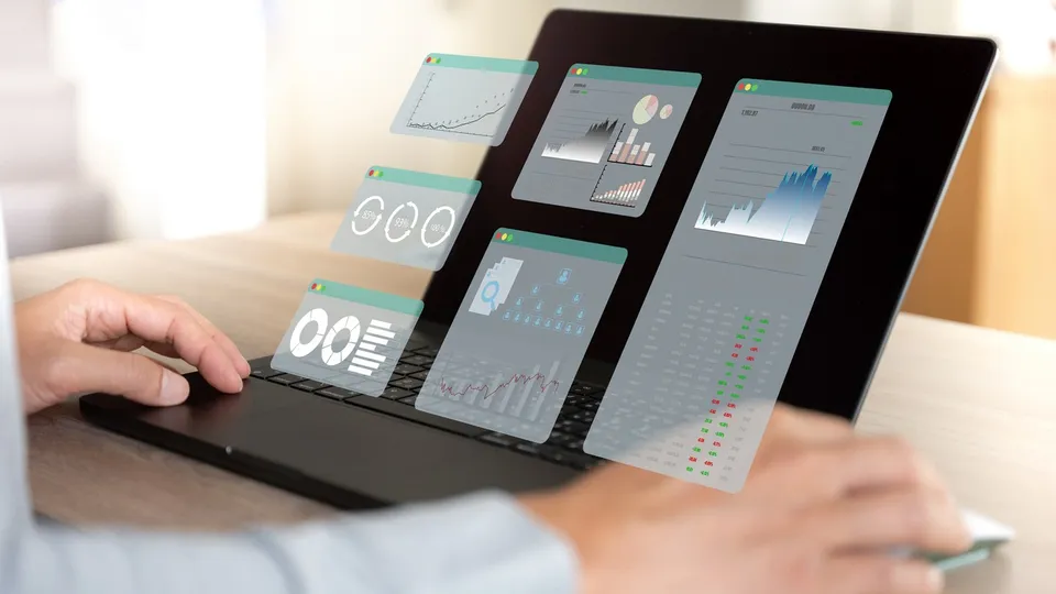 Hands on a tablet with a dashboard on screen
